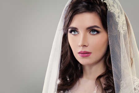 Cute Fiancee with Make up, Bridal Hairstyle and Veil. Classic Styleの写真素材