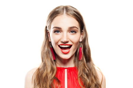 Happy Surprised Woman with Open Mouth. Cute Fashion Model with Makeup and Long Hair on White Background. Surprised Face Closeupの写真素材