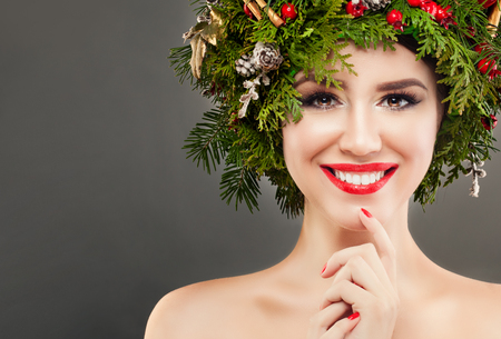 Perfect Christmas Girl Smiling. Beautiful Model with Cute Smile. New Year or Christmas Conceptの写真素材