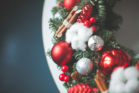 Christmas Background with Xmas Evergreen Twig, Red Glass Balls and New Year Decorationsの写真素材