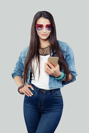 Cute Young Woman with Cell Phoneの写真素材