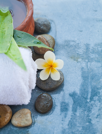 Top view of spa objects and stones for relax massage salon on blue background.の写真素材