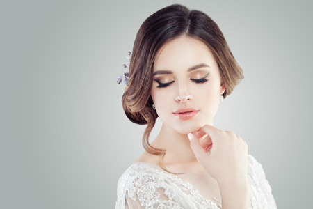 Cute young woman with makeup, closed eyesの写真素材