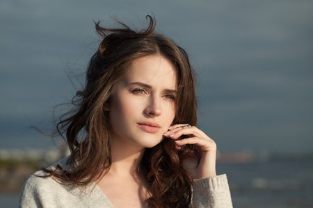 Young perfect woman outdoors, romantic portrait. Beautiful female face close upの写真素材