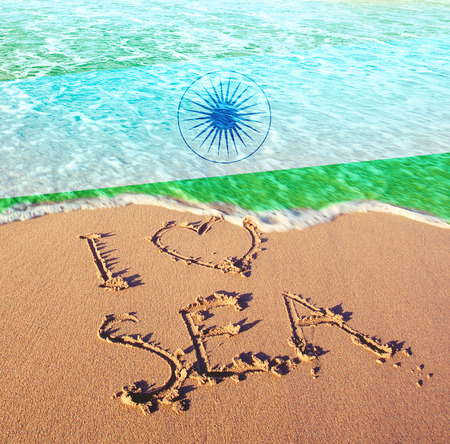 Beach sand, sea and flag India. I love India conceptの写真素材