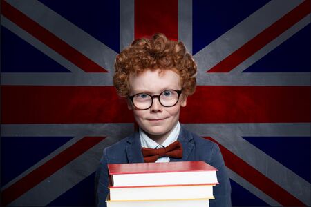 Child boy on the UK flag backgroundの写真素材