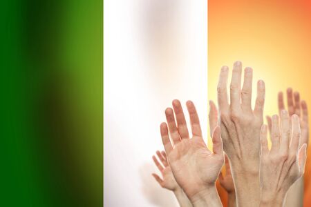 People raising hands and  flag Italy on background. Patriotic conceptの写真素材