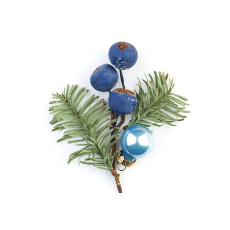 Christmas baubles, frozen winter blue berries and green fir branch on white backgroundの写真素材