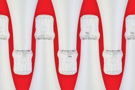 White sparkling wine bottle in row. Holidays and celebrations conceptの写真素材
