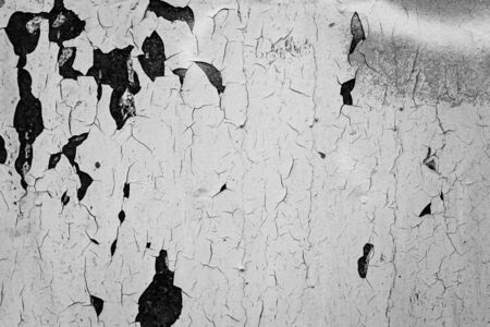 Cracked aged grung black and white textures cement stucco wall backgroundの写真素材
