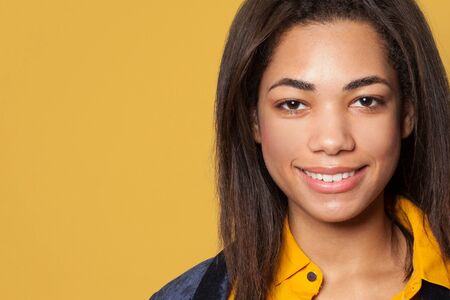 Closeup female face. Smiling African American woman