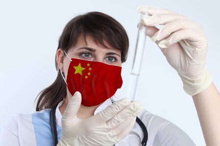 Medical researcher or doctor with clear solution in laboratoryの写真素材