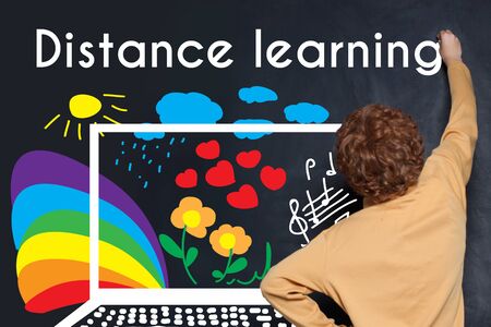 Distance learning background with school boy and colorful sketchesの写真素材