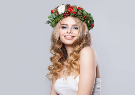 Happy woman with long healthy curly hair smiling on white backgroundの写真素材