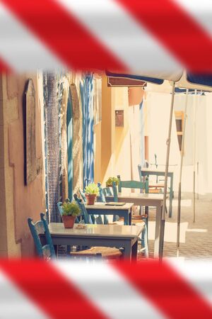 Empty street cafe with warning tapeの写真素材