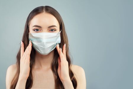 Pretty model woman in protective maskの写真素材