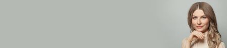 Beautiful woman on white banner background with copy spaceの写真素材