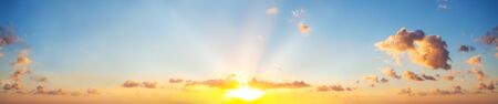 Sunset sky clouds background. Beautiful landscape with clouds and orange sun on sky
の写真素材