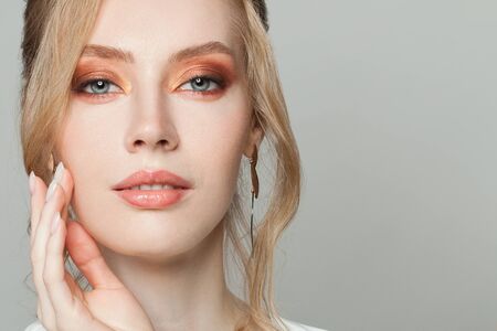 Beautiful face close up. Elegant young blonde woman portraitの写真素材