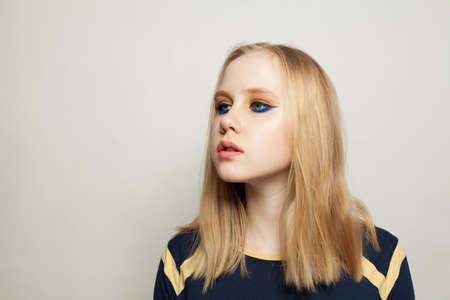 Girl with black eyeliner makeup in day lightの写真素材