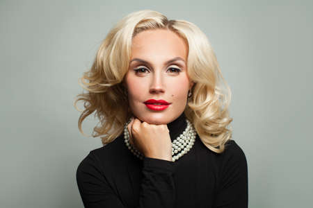 Fashion beauty portrait of perfect model woman in pearls necklace and black turtleneck