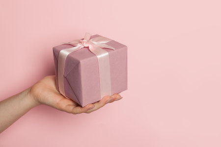 Minimal composition with gift on pastel pink backgroundの写真素材