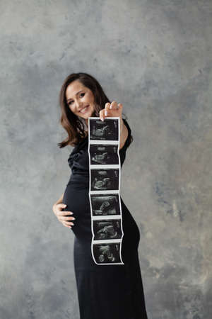 Ultrasound scan image in pregnant woman handsの写真素材