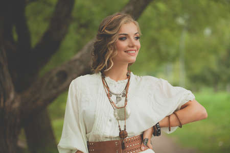 Happy woman with blonde hair outdoorの写真素材