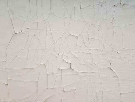 Abstract white cracked grunge decorative stucco wall background
