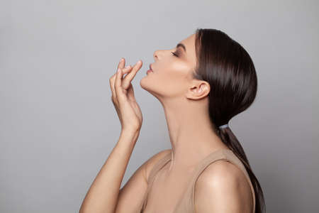 Beautiful female profile. Healthy model woman with clean skin and perfect face. Skincare, cosmetology and facial treatment conceptの写真素材