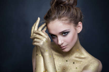 Portrait of a sensual brunette lady on dark backgroundの写真素材