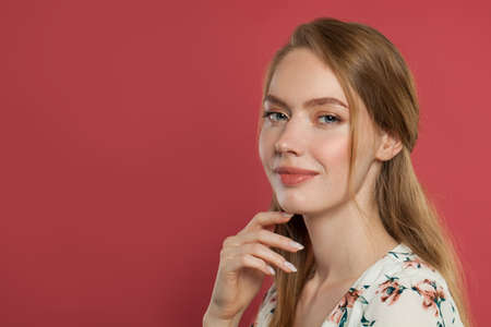 Happy cheerful young woman with charming smile and healthy skin. Ginger student model portraitの写真素材