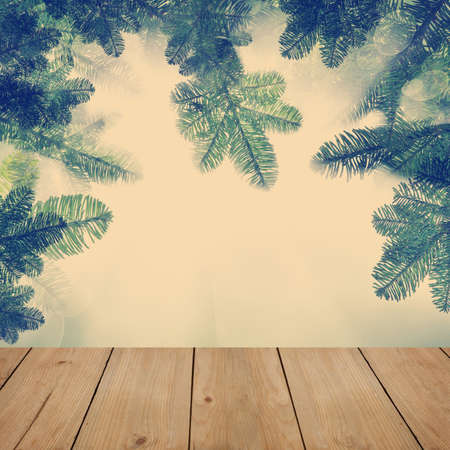 Nature background with green tree elements. Xmas card empty blank wooden tableの写真素材