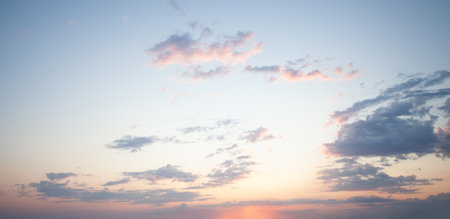 Blue sky clouds background. Beautiful landscape with clouds and orange sun on sunset sky