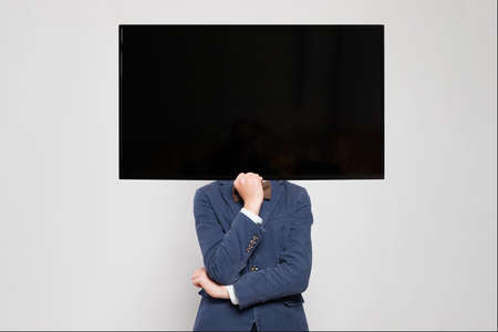 Thinking child boy with ginger hair portraitの写真素材