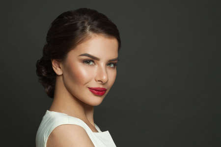 Gorgeous young brunette woman smiling, female face close upの写真素材