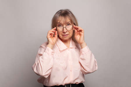 Mature woman teacher on white backgroundの写真素材