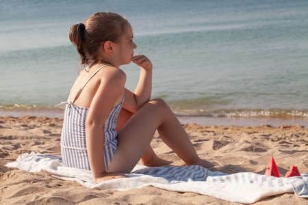 Child on tropical beach. Summer vacation.の写真素材