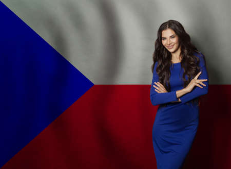 Happy beautiful young woman smiling against flag of Czech Republic backgroundの写真素材