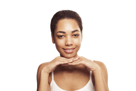 Beauty. Smiling black woman with perfect clean skin and natural makeup portrait. Beautiful happy...