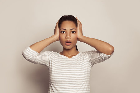 Cute surprised woman with opened mouth on white background