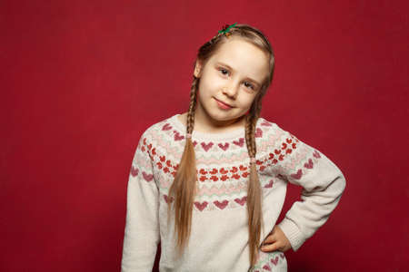 Adorable happy smiling attractive young girl child looking at camera