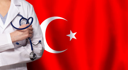 Turkish medicine and healthcare concept. Doctor close up against flag of Turkey backgroundの写真素材