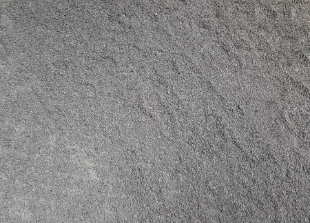 Smooth gray sand background on beach.