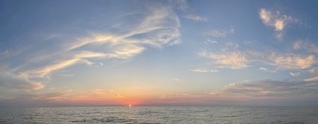 Panoramic beautiful seascape with cloud on a sunny eveningの写真素材