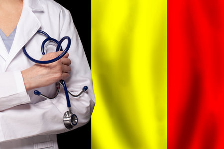 Belgian medicine and healthcare concept. Doctor close up against flag of Belgium backgroundの写真素材