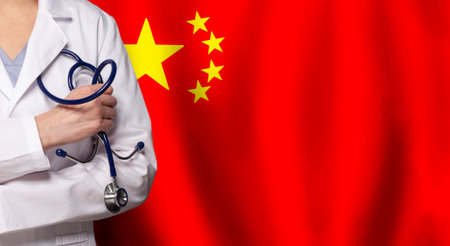 Chinese medicine and healthcare concept. Doctor close up against flag of China backgroundの写真素材