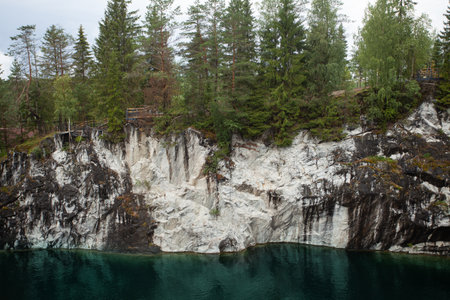 Cute landscape of rock cliff, forest and mountain riverの写真素材