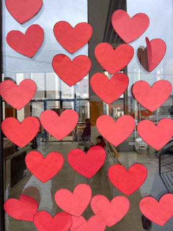 Empty red hearts with copy space on glass doorの写真素材