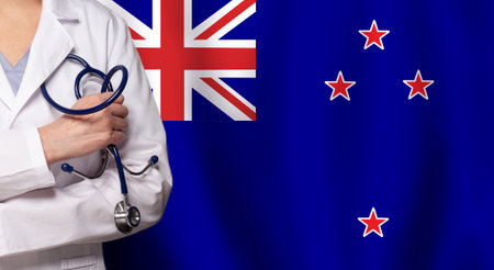 New Zealand medicine and healthcare concept. Doctor close up against flag of New Zealand backgroundの写真素材